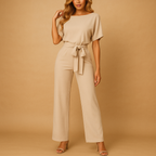 High-waist jumpsuit for women with lace-up detail and flattering fit, perfect for work, evenings out, and chic occasions.