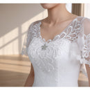 One shoulder lace wedding dress with elegant bridal styling