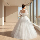 One shoulder lace wedding dress with elegant bridal styling