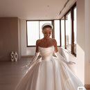 Satin strapless bridal gown with a classic elegant silhouette