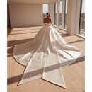 Satin strapless bridal gown with a classic elegant silhouette