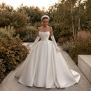 Satin strapless bridal gown with a classic elegant silhouette