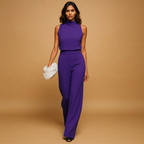 Sleeveless halter jumpsuit for women with high waist, wide legs, and decorative bow detail, perfect for summer dinners and evening occasions.